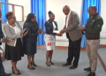 Mku Founder, Prof. Simon Gicharu, Awards Hamia Adhiambo Ouma. Photo/Mku.