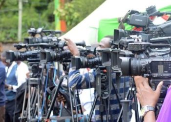 A Group Of Journalists At A Past Press Briefing.