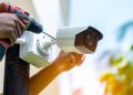 A Person Installing Cctv Camera.