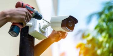 A Person Installing Cctv Camera.
