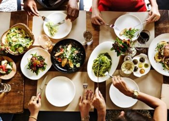 A Group Of People Enjoying A Meal.
