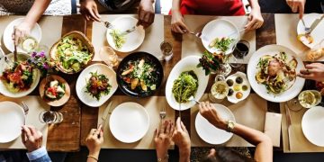 A Group Of People Enjoying A Meal.