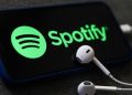 A Spotify Logo On Phone And Earphones. Photo/Ugc