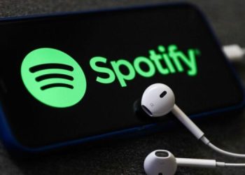 A Spotify Logo On Phone And Earphones. Photo/Ugc