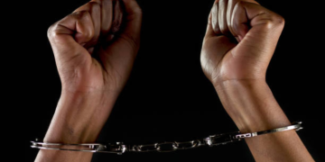 A Photo Of A Woman In Handcuffs Photo/Istock