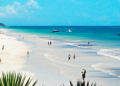 A Photo Of Visitors Enjoying The Sun And Sea At Diani Beach. Photo/Diani