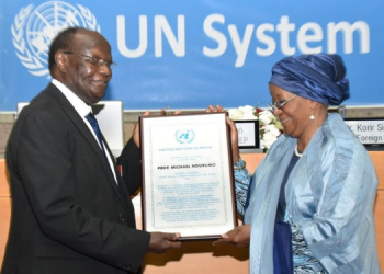 Professor Michael Ndurumo Receiving The Un In Kenya Person Of The Year Award From Director-General, Un Office At Nairobi( Unon) Mrs Zainab Hawa Bangura Photo/Un