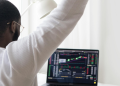 A Forex Trader Monitoring Trends. Photo-Handout