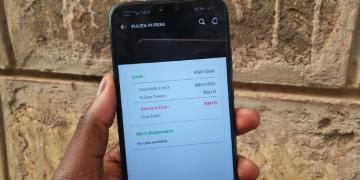 Safaricom Explains How Fuliza Loan Limits Are Set For Active M-Pesa Users A Photo Of A User Holding A Mobile Phone Displaying Fuliza Menu. Photo/Techarena