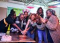 Blankets And Wine Team Cutting A Cake During The 17 Year Birthday. Photo/ File