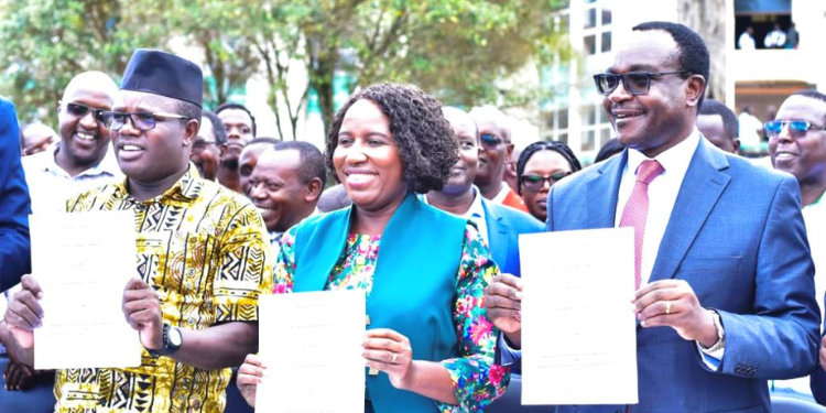 Strike Over! Uasu Orders Lecturers To Return To Classrooms Education Cs Julius Ogamba (Right) And Moi University Union Officials Led By Uasu Secretary General Dr. Constantine Wasonga Display The Signed Agreements To End Their Strike Last Year.