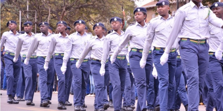 Nairobi Kanjos Start Spray-Painting Cars Parked Illegally Nairobi County Council Askaris Match In A Parade. Photo/Nairobicitycounty